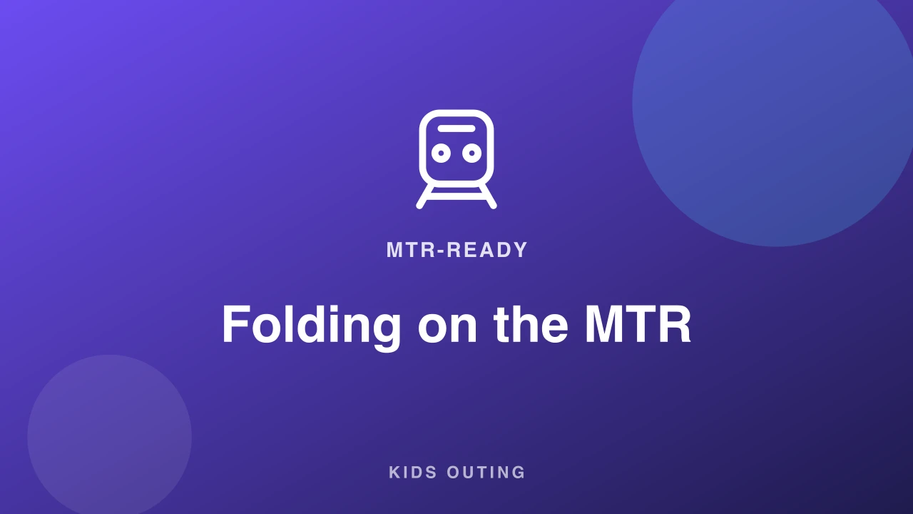 Compact one-hand-fold travel stroller standing folded next to an MTR turnstile gate